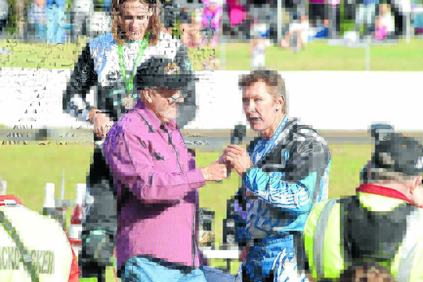 Troy Bayliss speaking after winning one of three titles at the Australian Dirt Track Championships at the Old Bar Roadside Circuit last June. Troy Bayliss Events will be the major sponsor of the Australian Senior Track Championships at the track in August. Bayliss is expected to be among the competitors.