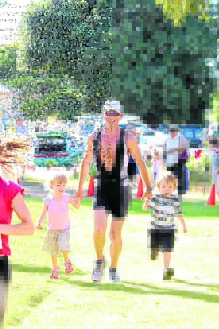 Brendan, after competeing in the Taree Traitholon held at Cundletown in 2008, with his twins Tyra and Baden by his side.