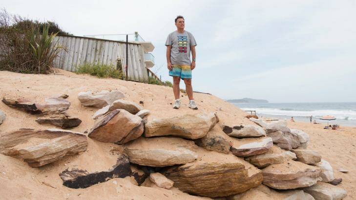 Collaroy resident Garry Silk standing on the site where the June east coast low tore away the dunes protecting his beachside home. A swimming pool lies beneath his feet, buried in the sea defence. Photo: James Brickwood