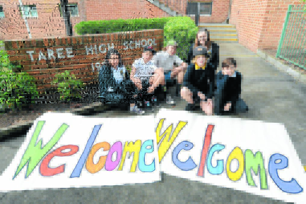 Taree High students, Emily Holtmeulen, Georgia McKewen, Jacob Brown, Harry Fisher, Cody Barlow and James Dumas with the welcome signs for the open day.