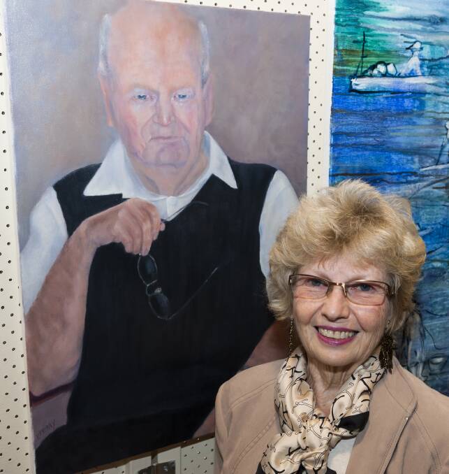 Victoria Perry with her work, Ray, which won the members of Taree Artists section. Her subject was Ray Taggart, well known as the post master at the Harrington Post Office.