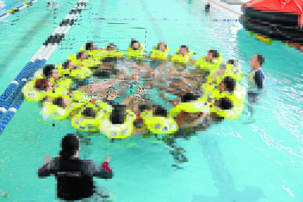 Increasing their chance of survival: Chatham High students and members of HMAS Albatross training at the aquatic leisure centre.