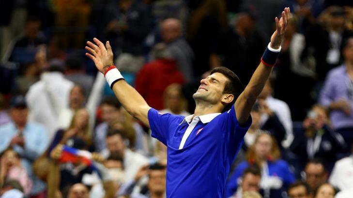 Victory: Novak Djokovic celebrates after defeating Roger Federer to win the 2015 US Open in New York. Photo: Clive Brunskill