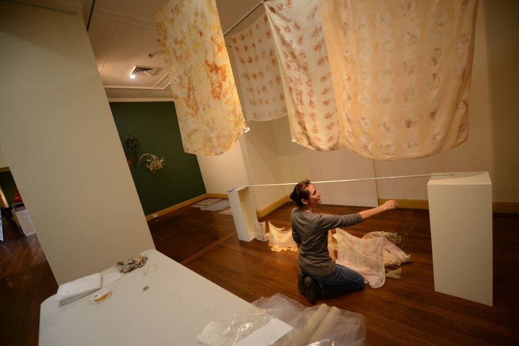 Setting up the group's first exhibition at Manning Regional Art Gallery. 