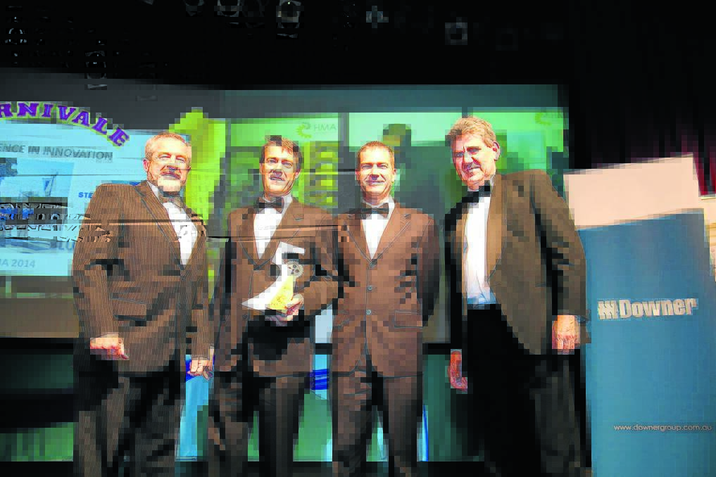 Alan, Graham and Colin Steber receive the Innovation Award from Tristram Travers, director for energy, water and waste management, NSW Department of Industry.