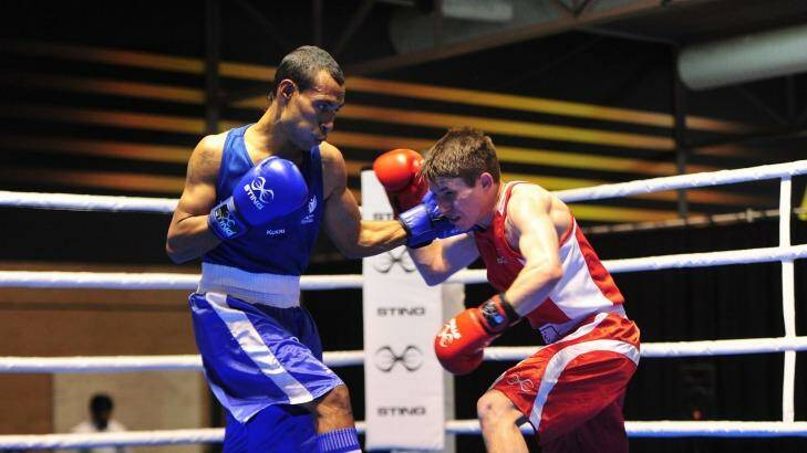 From left, Charles Keama and Ivan Pavich in action during the Men's Fly (52kg). Photo: Melissa Adams
