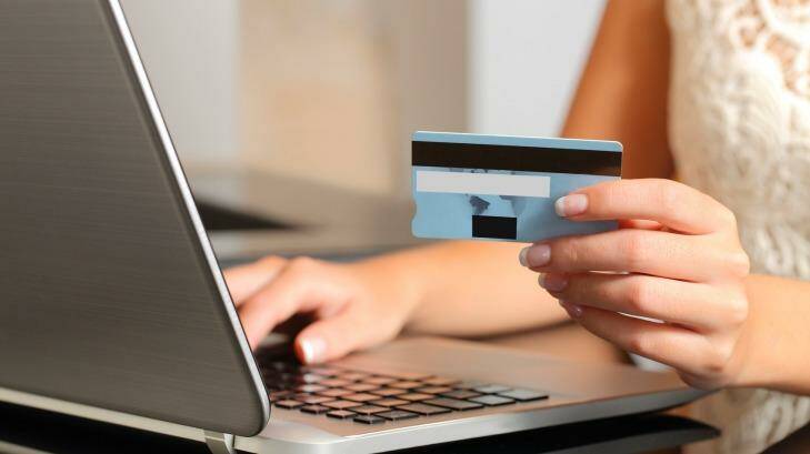 Woman making an online booking with a credit card and a laptop. iStock Photo: iStock
