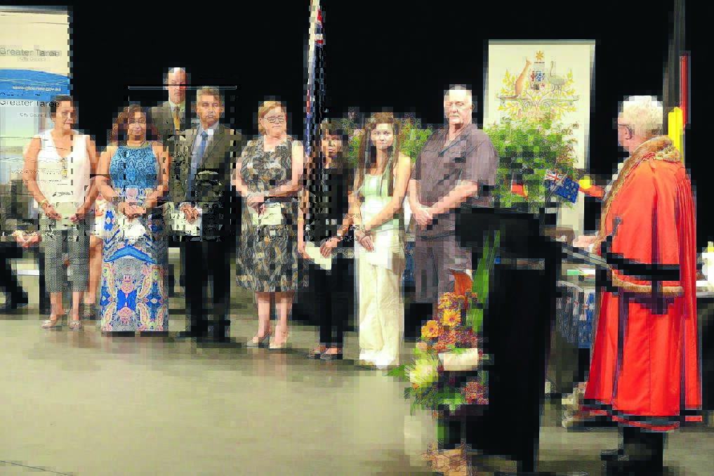 Mayor Paul Hogan conducts the citizenship ceremony during the Australia Day function at the Manning Entertainment Centre.