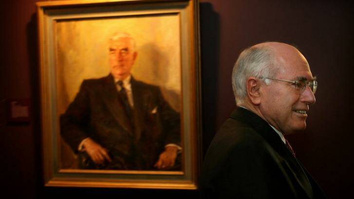 John Howard with a portrait of Menzies at Old Parliament House. Photo: Glen McCurtayne