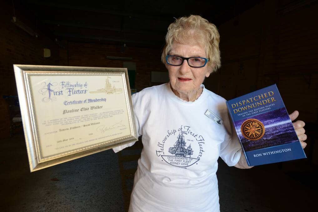 Pauline Walker holds her official Fellowship of the First Fleeters' certificate and a copy of 'Dispatched Downunder' one of the many history books she owns with details on the lives and deaths of those who arrived on the First Fleet.