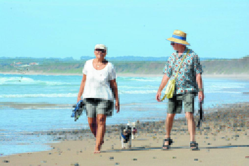 Pictured: Susan and Jim Crystal with Bill and Gretel on Old Bar Beach.
