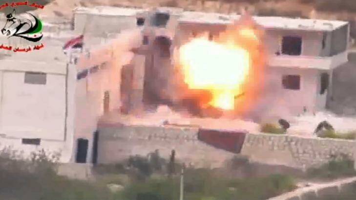 Footage supplied by the Free Syrian Army's Fursan al-Haq Brigade shows the moment of a US-supplied TOW missile's impact. Photo: Supplied