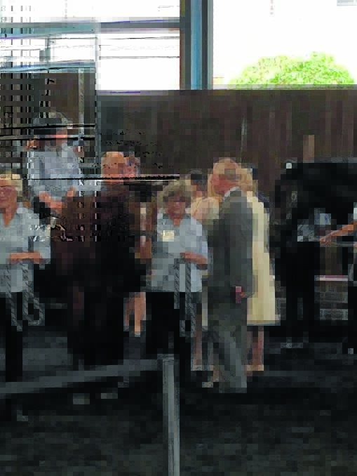 Manning Great Lakes Riding for the Disabled Association (RDA) rider Lillian Rowsell and her father Chris Rowsell talking to Prince Charles and Camilla.