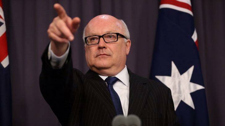 Attorney-General George Brandis pushed through higher divorce fees during the parliamentary winter break. Photo: Andrew Meares