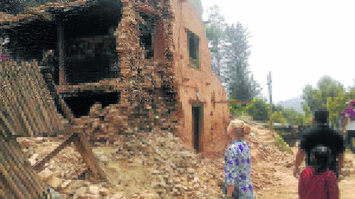 Jessica Bista surveying one of the many houses that collapsed as a result of the Gorkha earthquake on April 25.