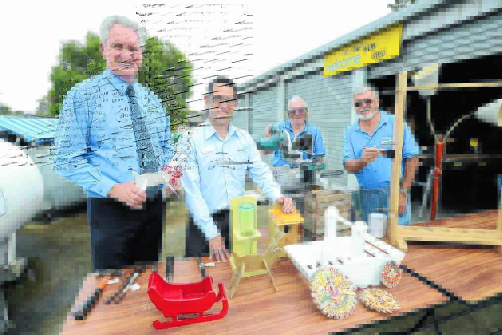 Club Old Bar manager Tony Jones and Greater Taree City Council's waste officer Ben Jenkins with Neil Cadden and John Macartney of Old Bar Men's Shed and some of the items they will have on offer on Saturday, October 25.