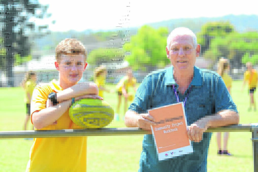 Taree High student and mentee Thomas Neal with mentor Geoff Heron at the touch football competition, organised as part of the Youth Frontiers Community Project.