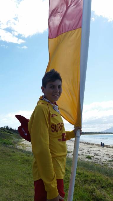 Raising the flag: Crowdy Head Surf Club member Odin Augey.