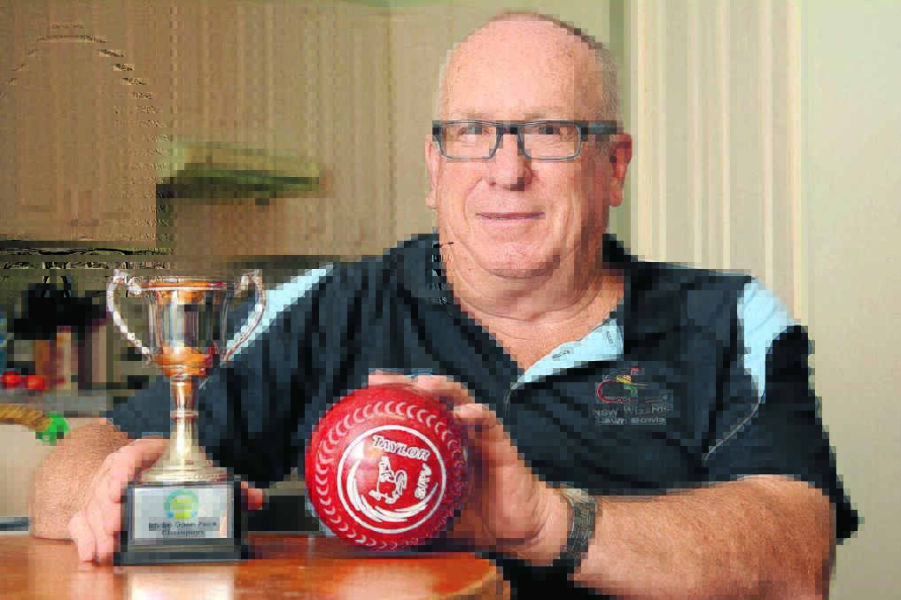 Gilbert Hicks with the trophy he received for winning the Australian pairs with Geoff Seton.