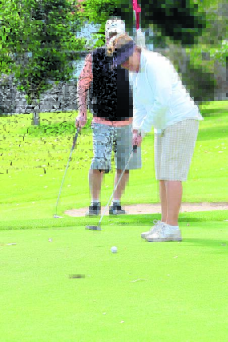 Anne Gyde playing in Club Taree Golf Club's mixed foursomes championships this year. The club will celebrate its 100th anniversary with a full program of gold starting on Monday May 25.