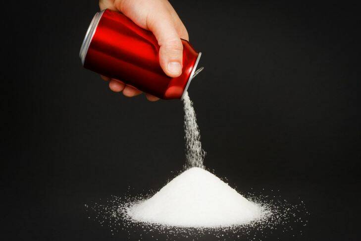 A can of sugar being poured out. Diet. Can. Soda. Soft drink. obesity. fat. Photo from Shutterstock.