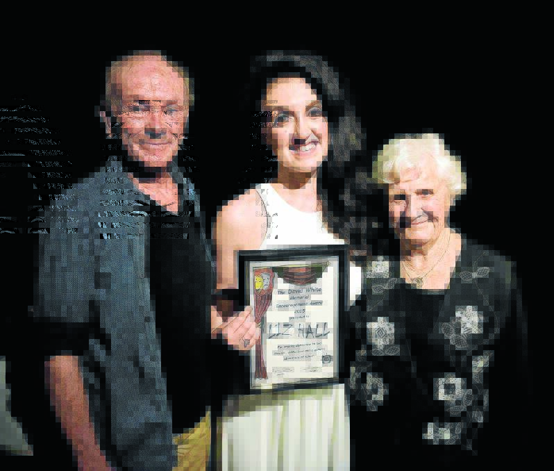Taree Arts Council president Bruce Wiseman (left)and Noelle White (right) congratulate Liz Hall on her David White Memorial Encouragement Award.