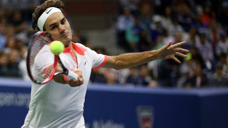 Beaten: Roger Federer returns a forehand to Novak Djokovic. Photo: Matthew Stockman