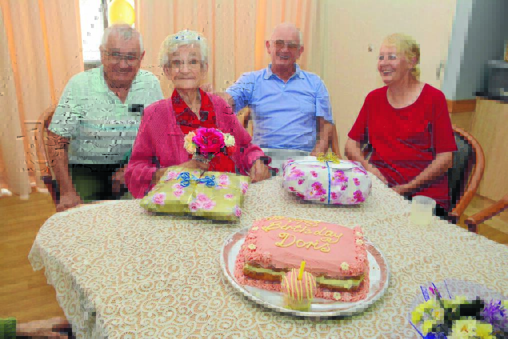 Dot Murray is flanked by her sons Peter and Barry Ryan, and Peter's wife Sandy on her 103rd birthday at Storm Village this week.