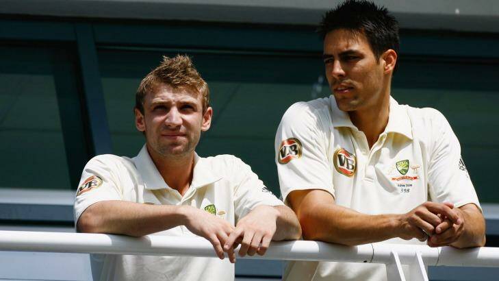 Mates: Hughes and Mitch Johnson look on from the balcony  during day one of the first Ashes Test in Cardiff in 2009. Photo: Getty Images 
