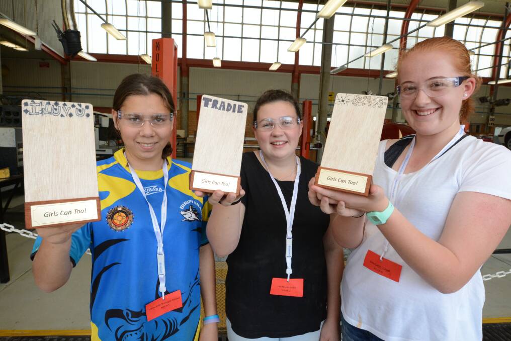 Valmarie Bungie-Beard, Maddie West and Charlotte Lloyd with the mobile phone stands they made.