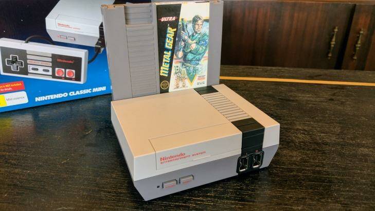 The Mini is around as wide as one original NES cartridge. Sadly, <i>Metal Gear</i> is not included. Photo: Tim Biggs