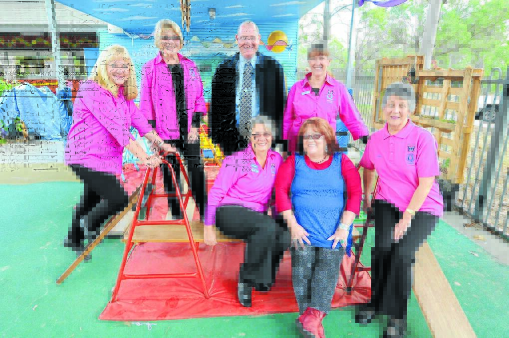 Community links aid children with special needs: Quotarians (in pink) Deb Steber, Cath Baker, Margaret Northam, Trish Webber and Dawn Beer with Manning Gardens School principal Paul Sortwell and early intervention teacher, Anne Gilchrist.
