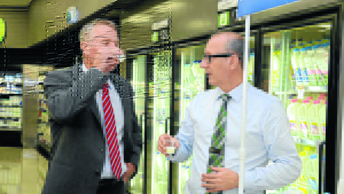 Woolworths Taree yesterday: NSW acting premier Andrew Stoner and Woolworths head of trade, Tony de Thomasis, at the announcement that distribution of Manning Valley Farmers Own Milk will be expanded.