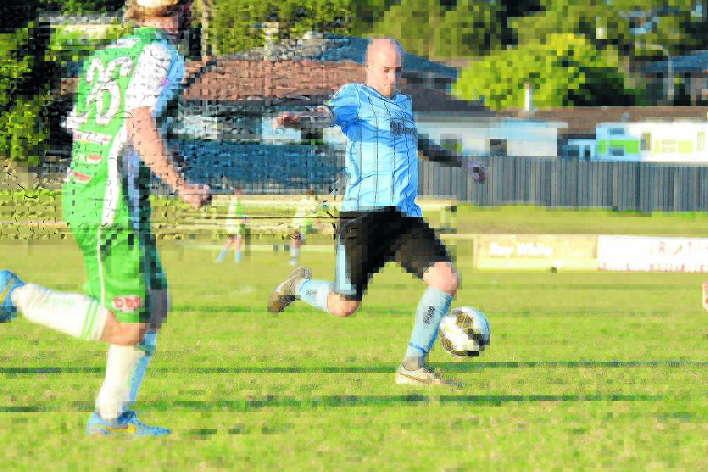 Aaron Green goes on the attack for Taree in a Football Mid North Coast Premier League clash at Omaru Park last season.