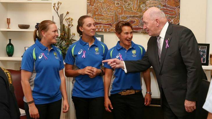 Sally Moylan, left with Ash Gardner and Shelley Nitschke, gets some advice from Governor-General Sir Peter Cosgrove. Photo: Alex Ellinghausen