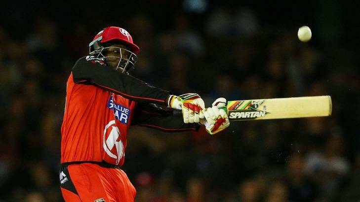 Going big: Chris Gayle blasted a quick but deadly innings on Monday night. Photo: Graham Denholm