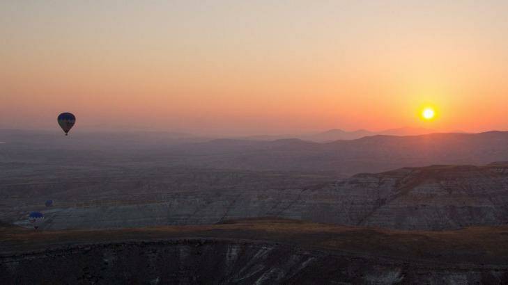 Watching the sunrise from a hot air balloon in  Cappadocia. Photo: Amanda Hoh