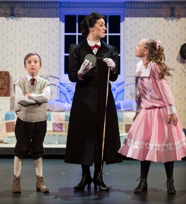Mary Poppins (Elizabeth Hall) measures up her young charges Michael (Wil Hellstedt) and Jane (Charlotte Reece).