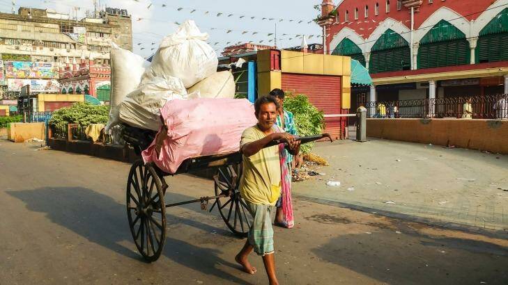 A Kolkata rickshaw puller hauling goods.  Photo: iStock