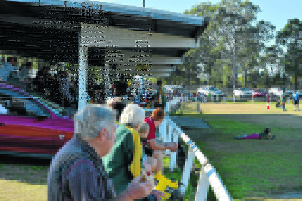 Spectators watch the action in a Group Three Rugby League game at Taree's Jack Neal Oval. 