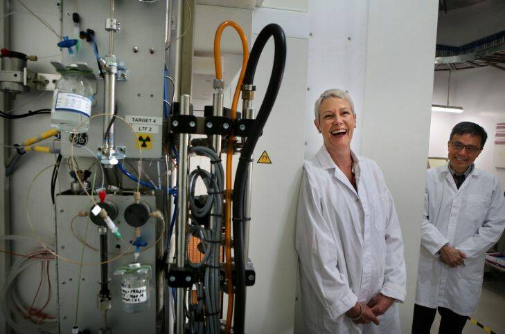 SYDNEY, AUSTRALIA - September 20, 2017: SYDNEY, AUSTRALIA - SMH NEWS: 200917: Story by Kate Aubusson: Happier times- Former patient Elizabeth Doonan shares a laugh with Clinical Director of Nuclear Medicine, Dr Peter Lin in front of a Cyclotron at Liverpool Hospital where Elizabeth underwent successful state-of-the-art treatment for life threatening cancer. (Photo by James Alcock/Fairfax Media).