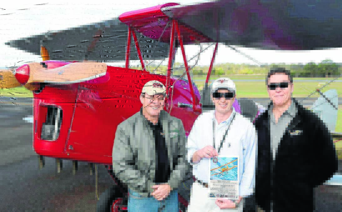 Former FA-18 fighter pilot and race director Richard Brougham, president of the Manning Aero Club Angus Laurie and LIFT director Darren Gough get ready for this weekend's Great Tiger Moth Air Race. Ashley Cleaver photo