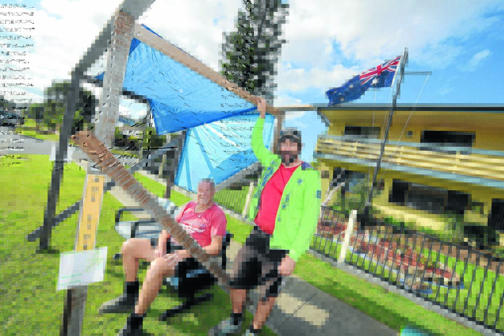 Peter Vidler and Peter Sierverts are the men behind Old Bar's pop-up bus shelter joke. Peter Vidler's front lawn (in the background) features a garden in the shape of Australia and the Australian flag. For more photographs see the Times web page.