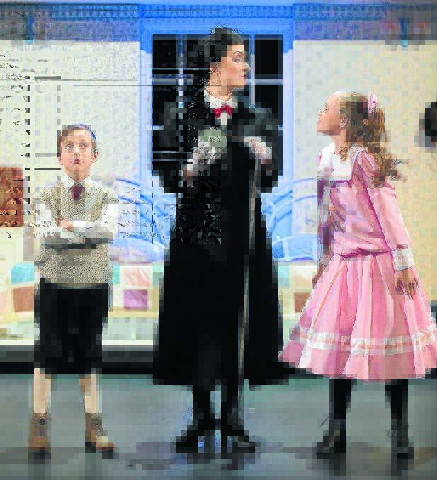 Mary Poppins (Elizabeth Hall) measures up her new charges Michael (Wil Hellstedt) and Jane (Charlotte Reece) Banks.