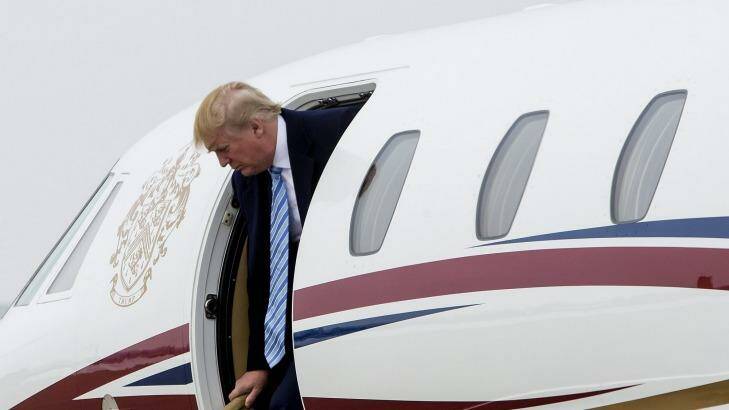 Welcome to the new age of conspicuous consumption: Donald Trump as he exits his private Cessna jet. Photo: NYT