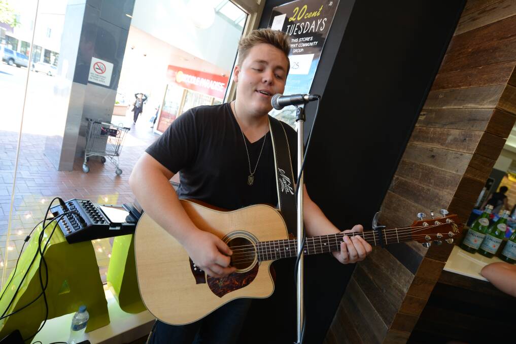 Jake Davey singing at a 'pop up gig' in Jack and Co in Taree Central.