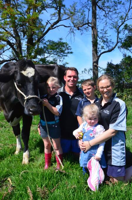 Family fun at the show: Ruby, Murray, Lachlan, Isabella and Jane Polson with cow Stanley Cup Cressy. Ruby, who is holding Stanley Cup Cressy, has been leading the cow at shows since she was a calf.