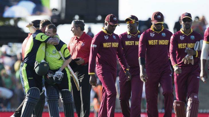 Down and out: West Indies team leaves the field after being beaten by Ireland. Photo: Marty Melville