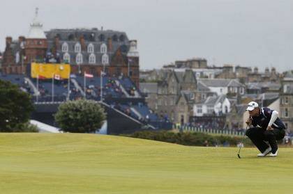 Australian Marc Leishman lines up his putt on the 16th green during the third round of the British Open golf championship on the Old Course in St. Andrews on Sunday. Photo: Paul Childs