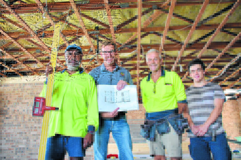 Hard at work: Biripi CEO Brett Cowling (second from left) with Reeman Properties indigenous employees Grant Jerome, Marc Streel and Coen Gleeson.